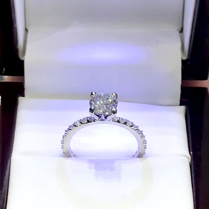 18kt White Gold Engagement Ring with 1.25 carat lab diamond at the center (Color: D | Clarity: VVS2 | Round Cut) and natural E / VVS grade Setting Diamonds.